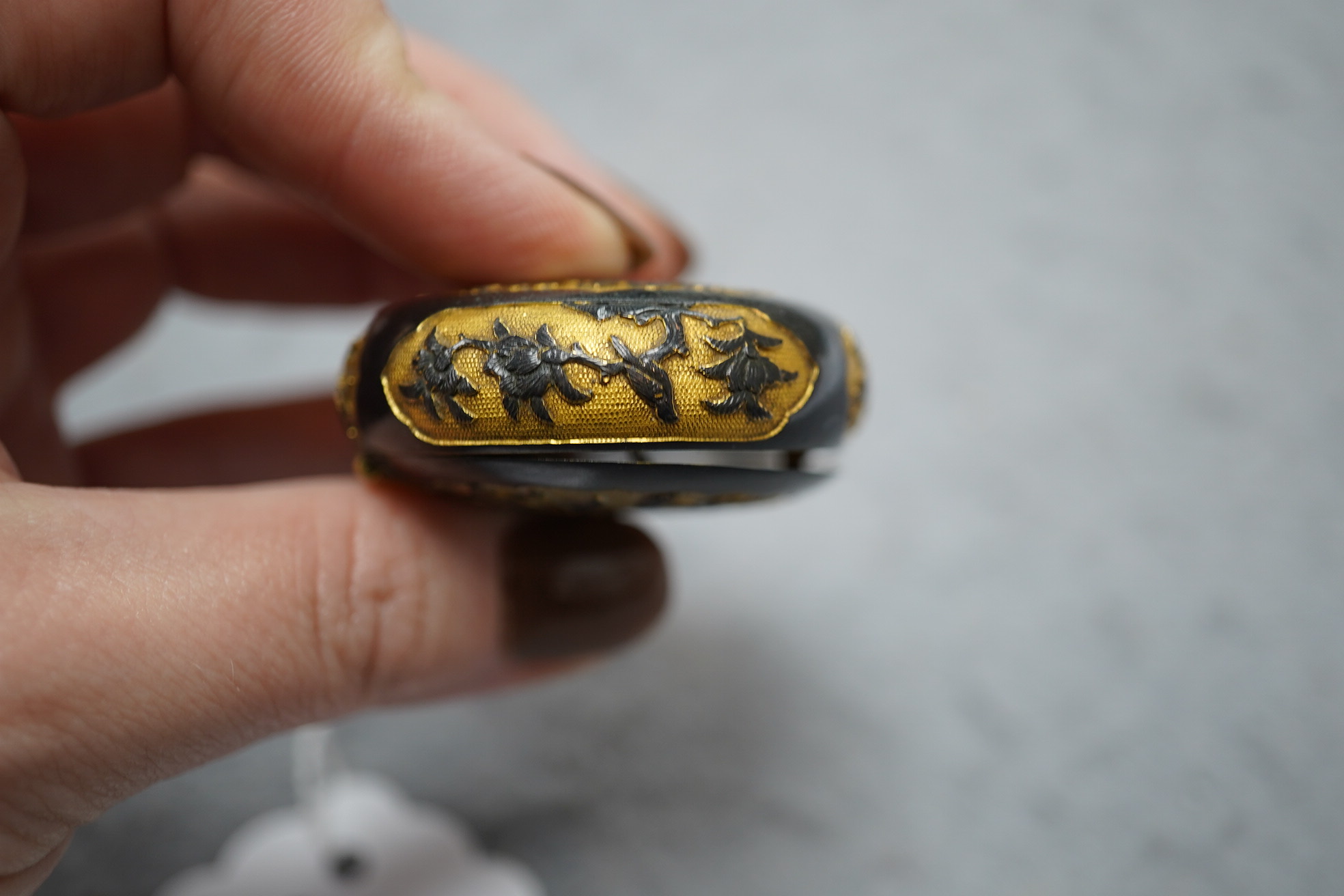 A small Japanese export gilt bronze Sawasa oval tobacco box, 18th century